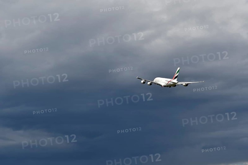 Emirates Airways Airbus A380-800 take-off in storm front with thundercloud, Munich Airport, Upper Bavaria, Bavaria, Germany, Europe