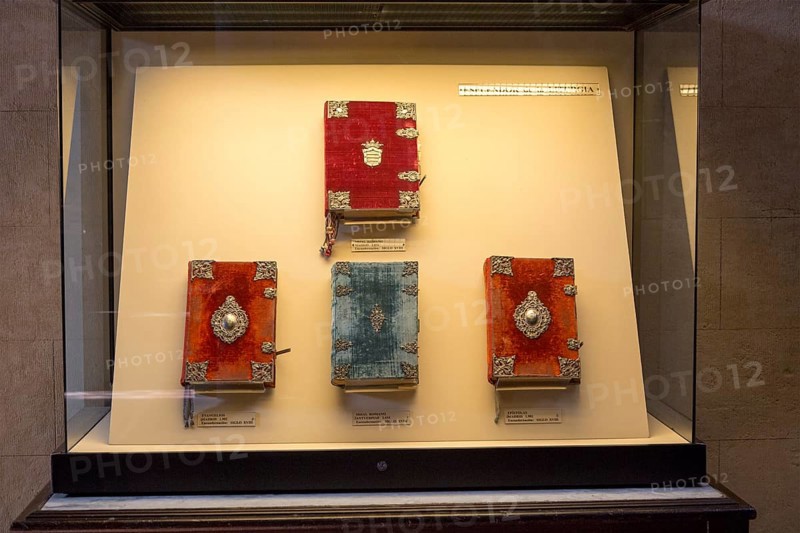 Glass display case of historic bible books inside the cathedral, former Great mosque, Cordoba, Spain, Europe