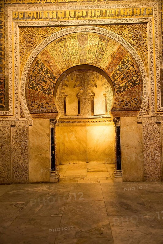 Richly inscribed stonework of keyhole shaped Mihrab, the centrepiece of the Great Mosque, Cordoba, Spain, Europe