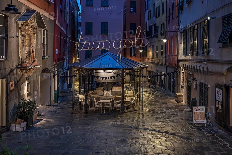 Rerstaurant seats in the evening in a historic public wash house, Piazza Truogoli di Santa Brigida, Genoa, Italy, Europe
