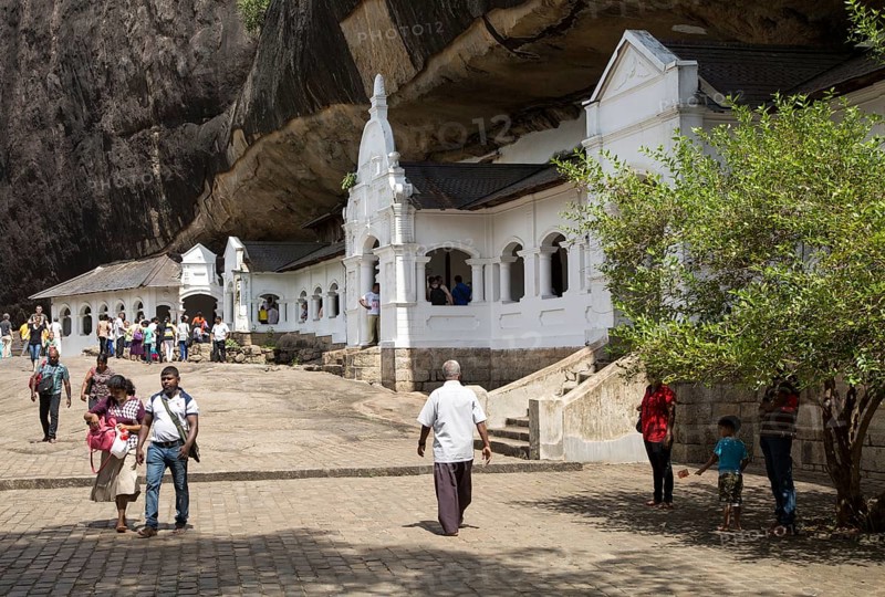 People at Dambulla cave Buddhist temple complex, Sri Lanka, Asia