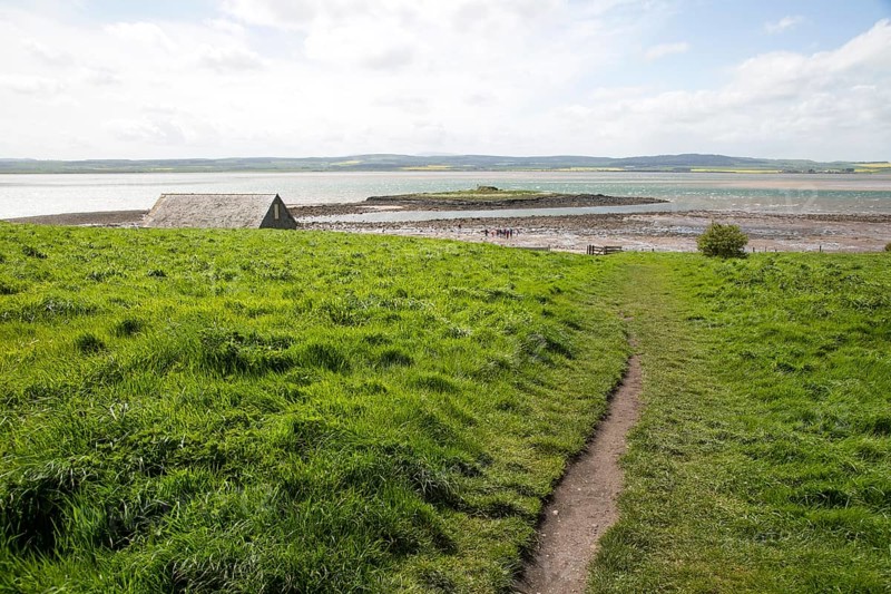 Path over filed to the coast, Holy Island, Lindisfarne, Northumberland, England, UK