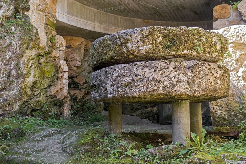 Old millstones in the Trou des Fees at the village Chassepierre near Florenville in the province of Luxembourg, Belgian Ardennes, Wallonia, Belgium, Europe