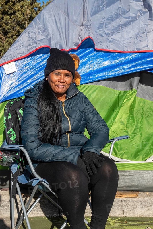 Denver, Colorado, Immigrants, mostly from Venezuela, live in a tent camp near downtown Denver. The city helped about 35, 000 migrants in 2023 with food and temporary shelter, but more continue to arrive daily on buses from the southern border