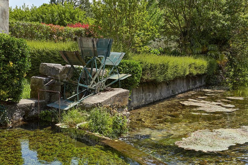 Old mill wheel of a watermill in Goudargues, Departement Gard, Occitanie region, France, Europe