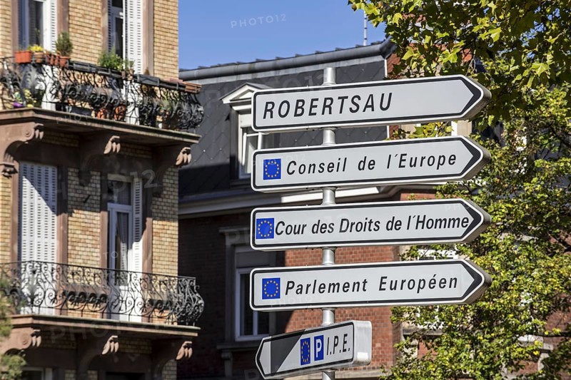 Signpost with directions to the several European Union office buildings in the European quarter at Strasbourg, France, Europe