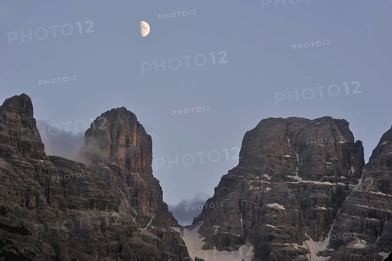 Moon over the mountain Monte Cristallo in the Dolomites, Italy, Europe