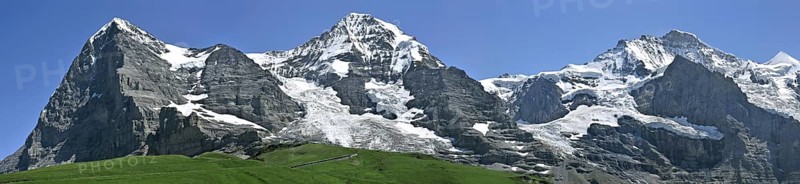 Panoramic view from the Kleine Scheidegg over the mountains Eiger (3970 m), Moench (4104 m) and Jungfrau (4158 m) in the Bernese Alps, Switzerland, Europe