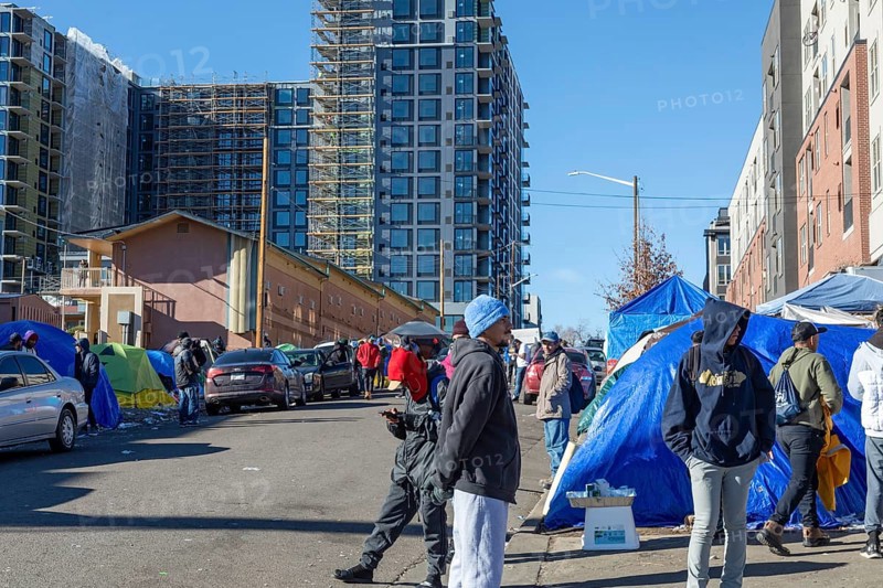 Denver, Colorado, Immigrants, mostly from Venezuela, live in a tent camp near downtown Denver. The city helped about 35, 000 migrants in 2023 with food and temporary shelter, but more continue to arrive daily on buses from the southern border