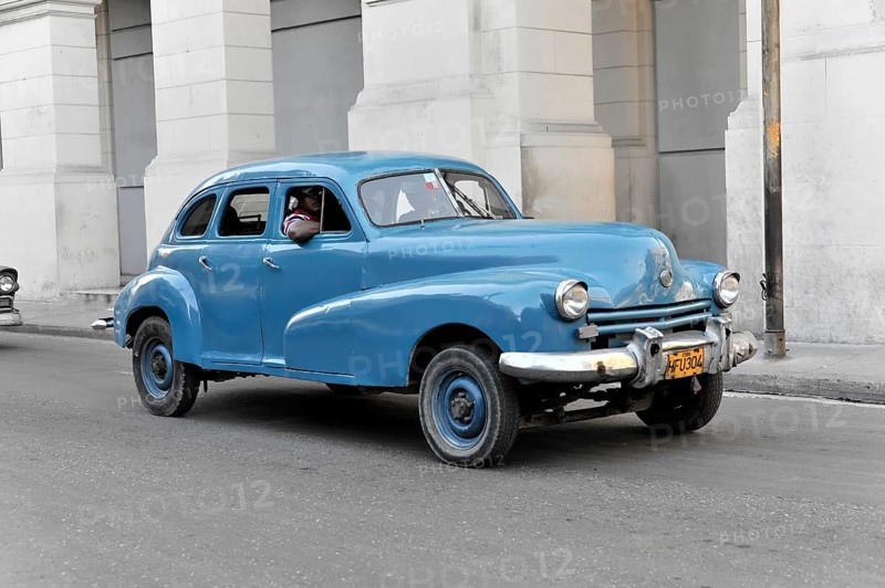Blue vintage car from the 50s in Avenida Simon Bolivar, Calle Reina, centre of Havana, Centro Habana, Cuba, Greater Antilles, Caribbean, Central America