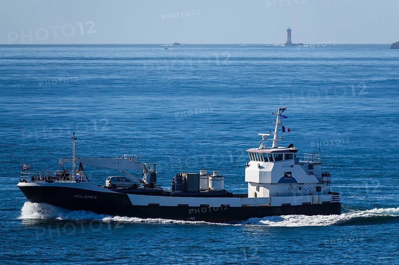 Transport ship Le Molenez for supplying the islands of Ouessant, Molene and Sein, here passing the Pointe Saint-Mathieu on its way to Brest, Plougonvelin, Finistere Penn ar Bed department, Bretagne Breizh region, France, Europe