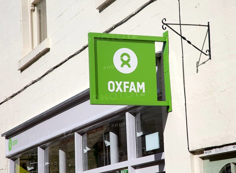 Oxfam charity shop sign, Corsham, Wiltshire, England, Uk