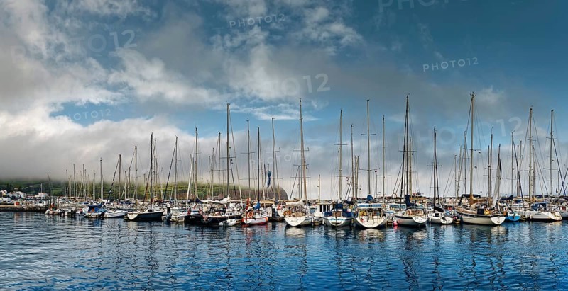 Reflection of sailboat masts in the water of the marina of Horta, Horta, Faial Island, Azores, Portugal, Europe