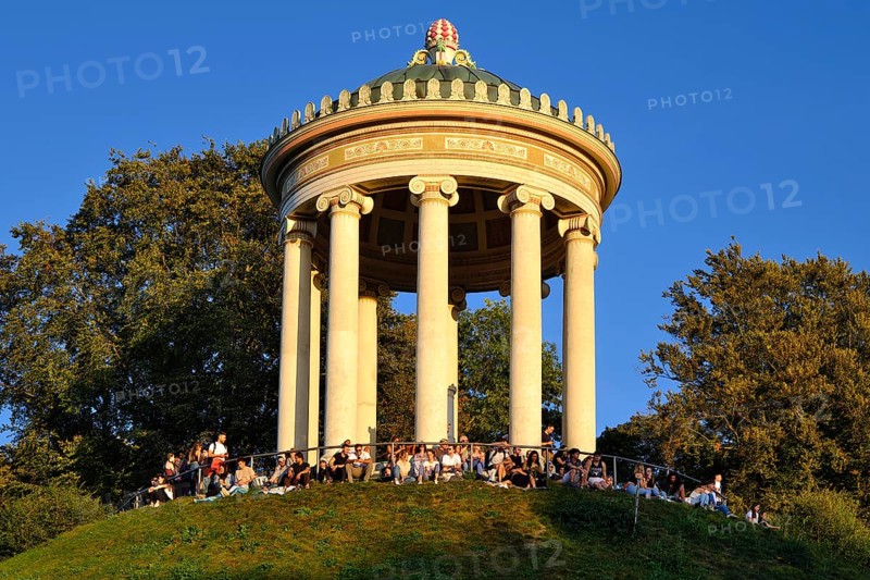 People enjoying the autumn sun at the Monopteros in the English Garden, Munich, Bavaria, Germany, Europe