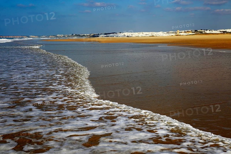 Wave breaking on sandy beach at Conil de la Frontera, Cadiz Province, Spain, Europe