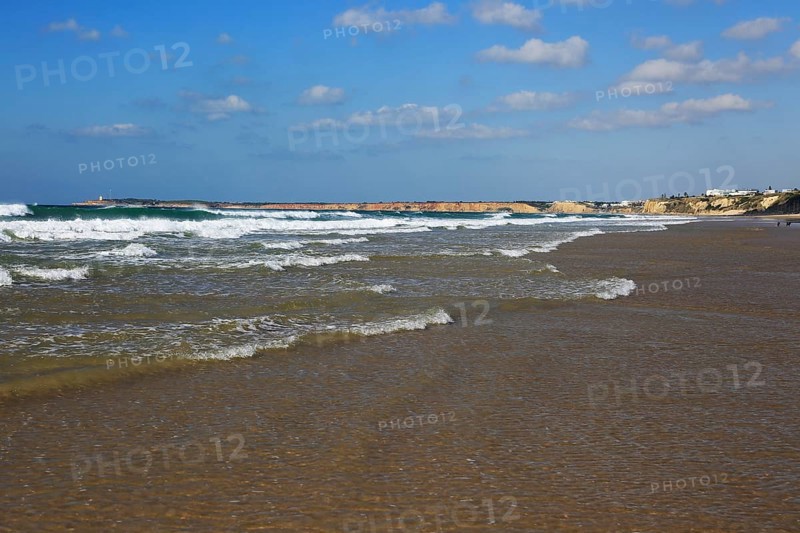 Waves breaking on sandy beach at Conil de la Frontera, Cadiz Province, Spain, Europe