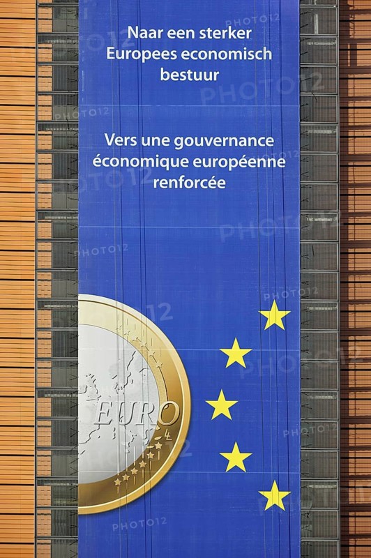 Banner about the euro hanging from the Berlaymont building of the European Commission, executive body of the European Union, Brussels, Belgium, Europe