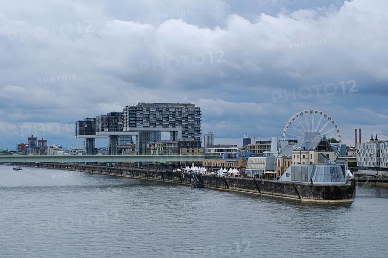 View over the Rhine with crane houses and Ferris wheel, Cologne, Germany, Europe