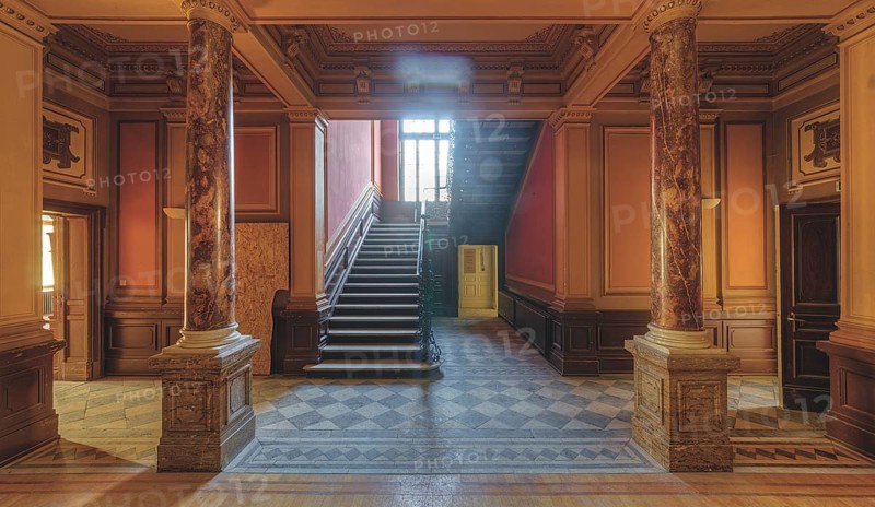 Magnificent entrance area with marble columns and a grand staircase in warm light, Villa Woodstock, Lost Place, Wuppertal, North Rhine-Westphalia, Germany, Europe