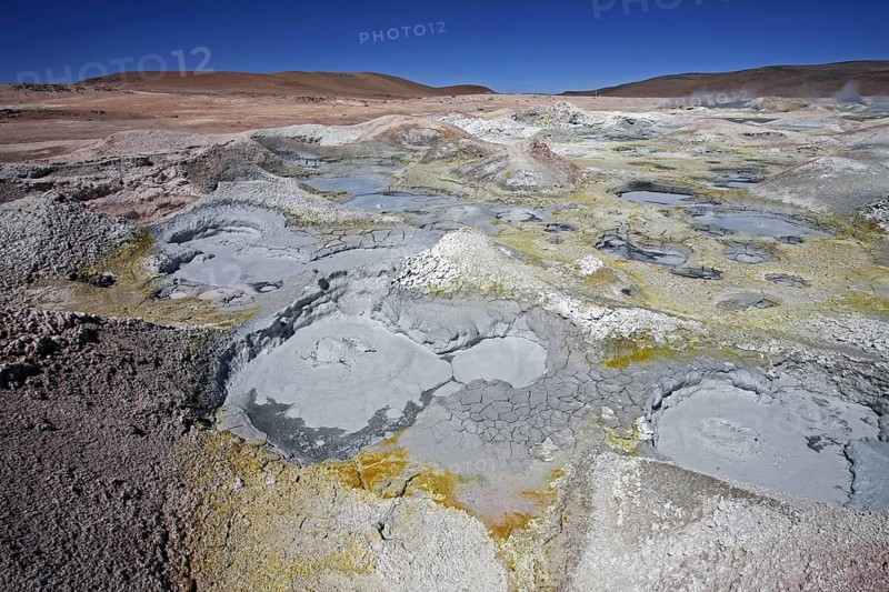 Mud lakes and steam pools with boiling mud in geothermal field Sol de Manana, Altiplano, Bolivia, South America