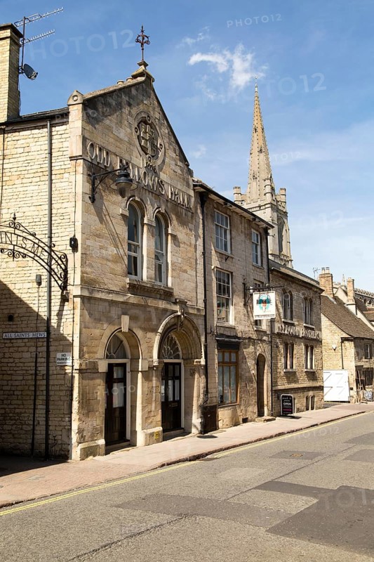 All Saints church spire and Old Fellows Hall, Church Street, Stamford, Lincolnshire, England, UK