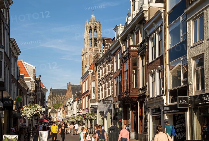 Historic buildings and famous fourteenth century Dom church tower in city of Utrecht, Netherlands