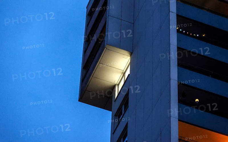 Illuminated flat in a tower block in Gropiusstadt. The rise in rents in German cities has increased again in the past year, Berlin, 16.01.2023