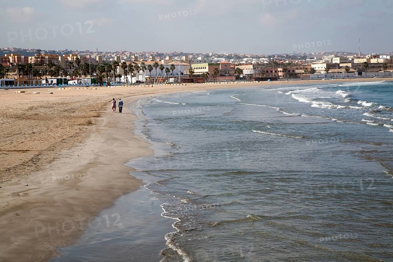 People walking on sandy beach Melilla autonomous city state Spanish territory in north Africa, Spain, Europe