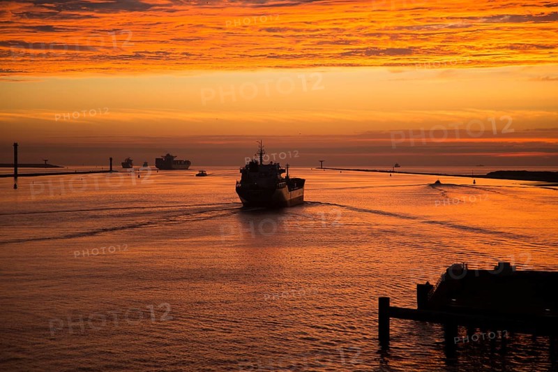 Sunset orange glow landscape clouds water, North Sea shipping, Port of Rotterdam, Hook of Holland, Netherlands