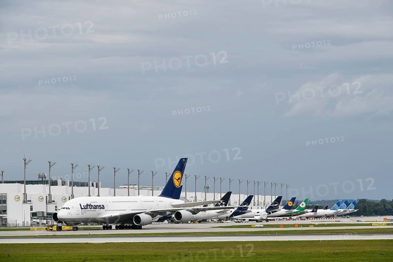 Lufthansa Airbus A380-800 in tow with push back truck in front of Terminal 2, Munich Airport, Upper Bavaria, Bavaria, Germany, Europe