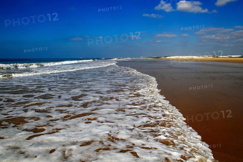 Wave breaking on sandy beach at Conil de la Frontera, Cadiz Province, Spain, Europe