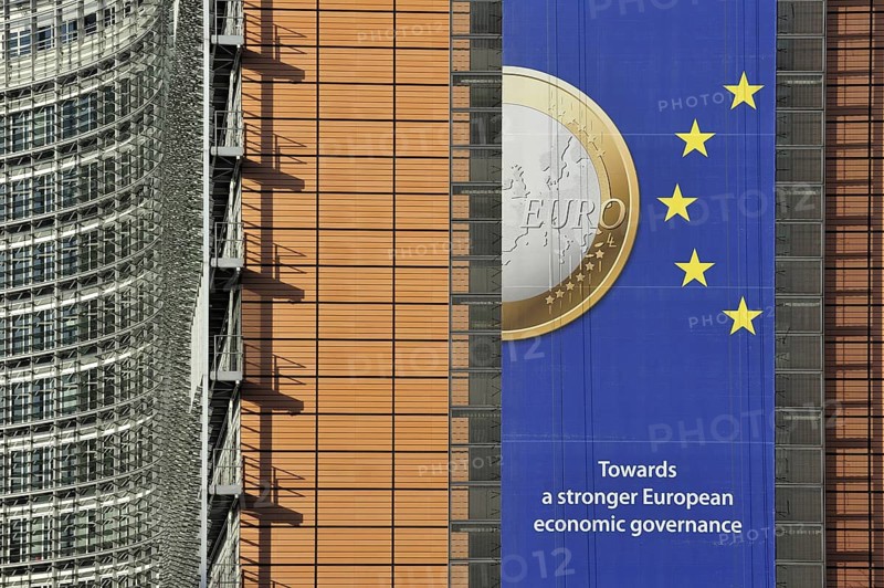 Banner about the euro hanging from the Berlaymont building of the European Commission, executive body of the European Union, Brussels, Belgium, Europe