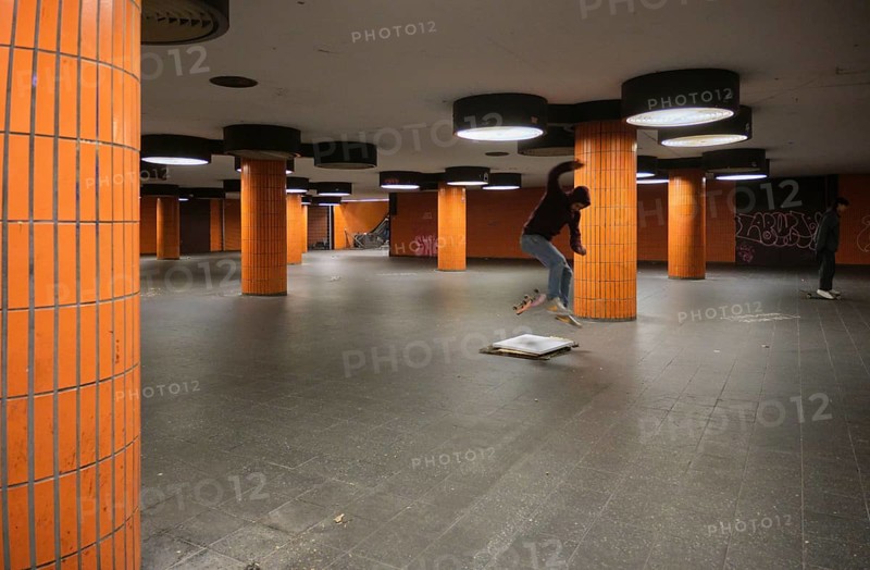 Germany, Berlin, 15.11.2023, Messedamm subway, orange columns, skaters, Europe