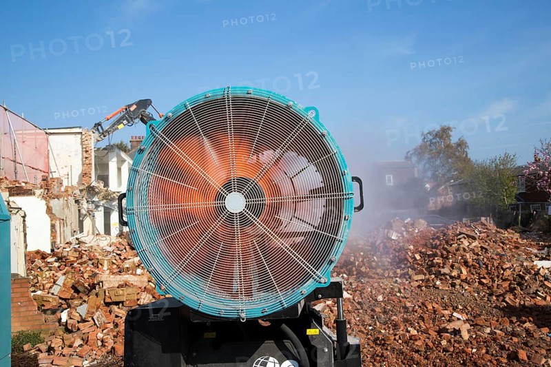 Dehaco water cannon sprayer dampening dust at a demolition site, Woodbridge, Suffolk, England, UK