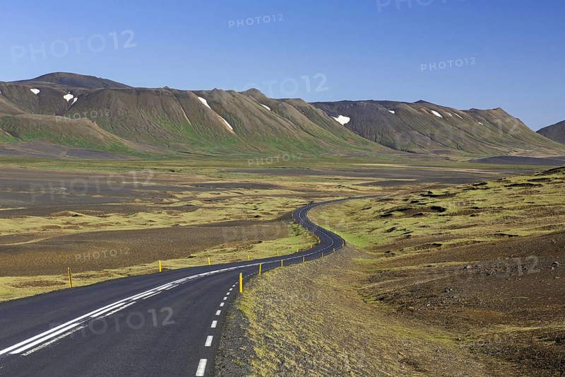 Empty Route 1, Ring Road, winding national road in desolate barren landscape in summer at Austurland, East Iceland