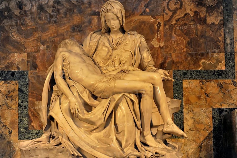 Marble sculpture Carrara white marble sculpture in warm light Pieta by Michelangelo Mary Mother of God mourns holding son, St Peter's Basilica, Vatican City, Vatican, Italy, Europe
