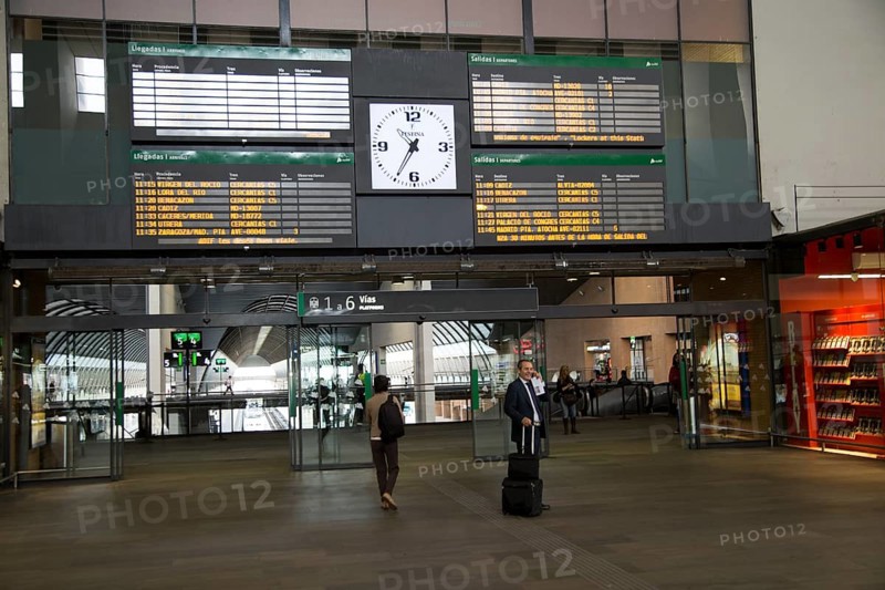 Electronic clock and display of travel information inside Santa Justa railway station, Seville, Spain, Europe