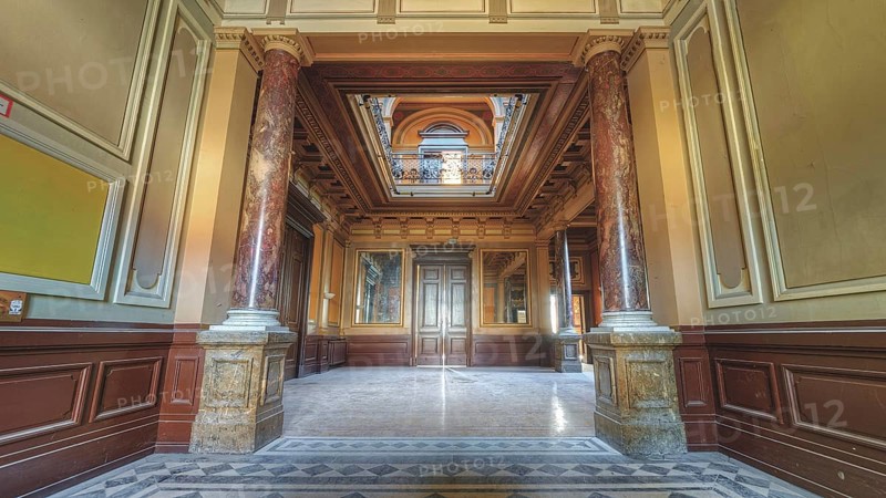 Symmetrical hallway with decorative ceiling and marble floor, flanked by columns, Villa Woodstock, Lost Place, Wuppertal, North Rhine-Westphalia, Germany, Europe