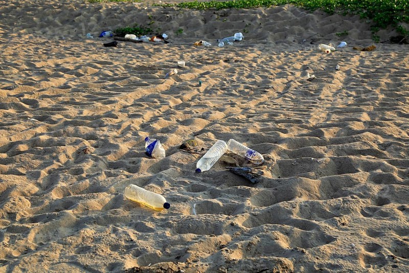 Plastic bottles litter on sandy beach, Nilavelli beach, Trincomalee, Sri Lanka, Asia