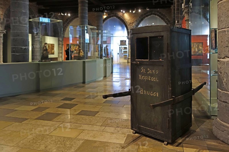 Medieval ambulance, sedan chair in the old sick-bay at the medieval Sint-Janshospitaal, St John's Hospital in the city Bruges, Flanders, Belgium, Europe