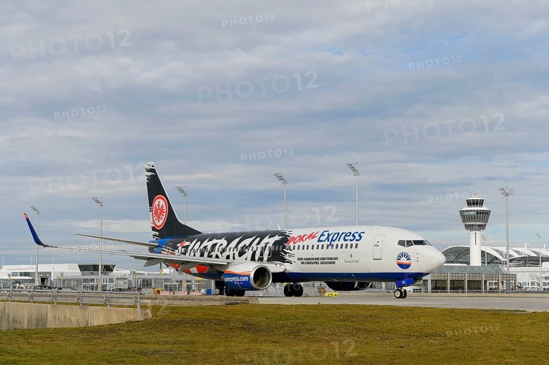 SunExpress with control tower taxiing from Terminal 1 onto Runway South, Munich Airport, Upper Bavaria, Bavaria, Germany, Europe