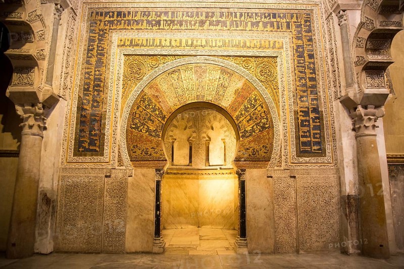 Richly inscribed stonework of keyhole shaped Mihrab, the centrepiece of the Great Mosque, Cordoba, Spain, Europe