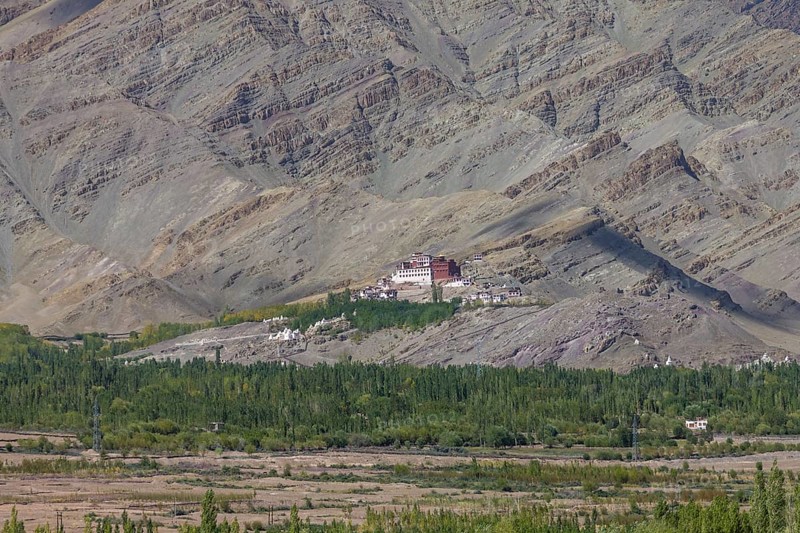 Matho Gompa, the Buddhist monastery of Central Ladakh, seen in mid-September, from the Thikse Monastery located on the opposite side of the Indus Valley. Mountains behind the monastery, with clearly visible strata, the rock layers, belong to the Zanskar Range of the Himalayas. Many inhabitants of Ladakh follow the Tibetan Buddhism, and this Indian region is often called Little Tibet. District Leh, Union Territory of Ladakh, India, Asia