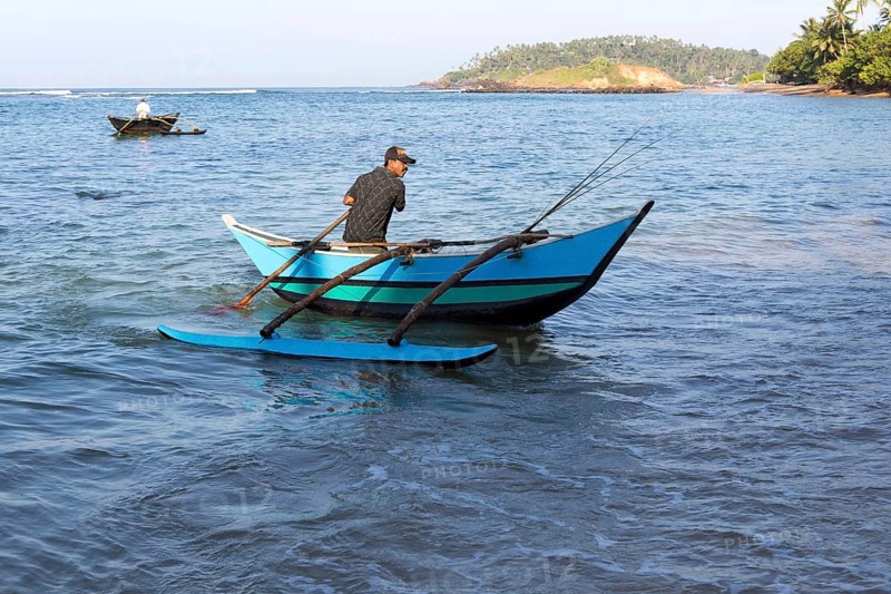Fishing using traditional outrigger canoes, Mirissa, Sri Lanka, Asia
