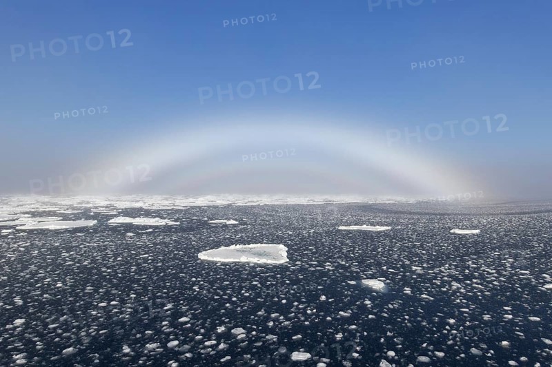 Fogbow, fog bow, white rainbow, sea-dog over the Arctic Sea at Svalbard, Norway, Europe