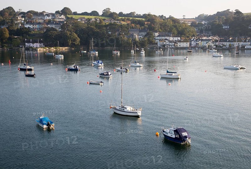 Yachts at moorings on River Fal, Flushing, Cornwall, England, UK