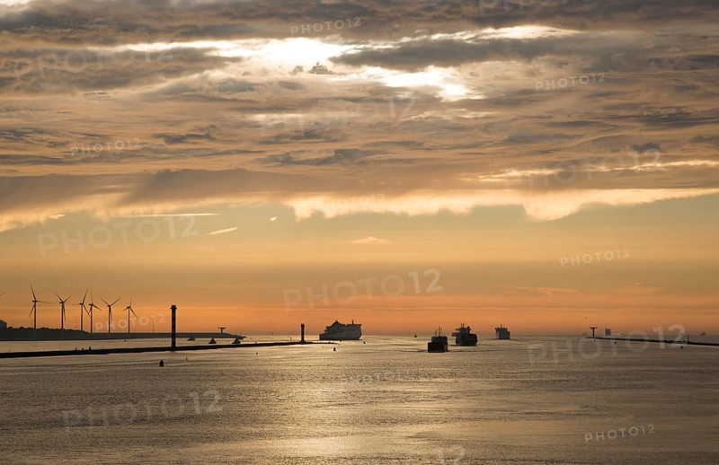 Sunset orange glow landscape clouds water, North Sea shipping, Port of Rotterdam, Hook of Holland, Netherlands