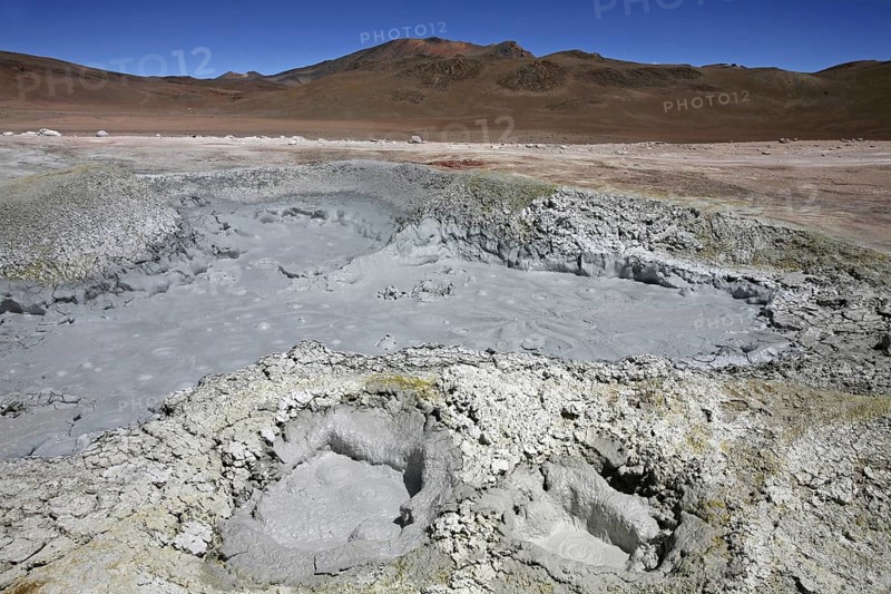 Mud lakes and steam pools with boiling mud in geothermal field Sol de Manana, Altiplano, Bolivia, South America