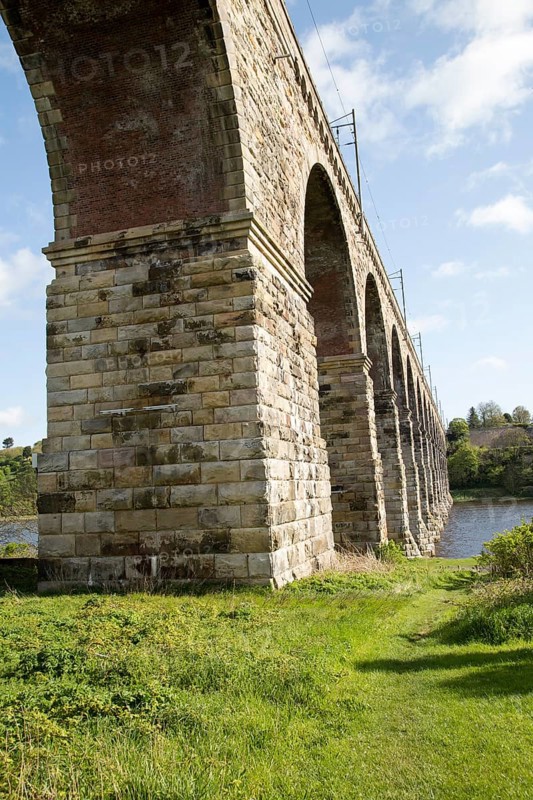 Stone arches of railway viaduct crossing River Tweed, Berwick-upon-Tweed, Northumberland, England, UK
