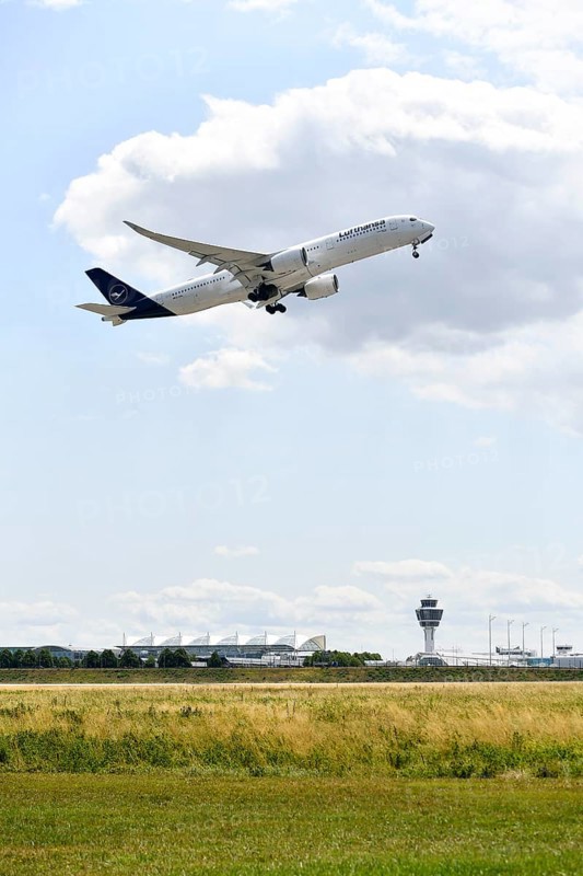 Lufthansa Airlines Airbus A350-900 taking off on Runway North with control tower, Munich Airport, Upper Bavaria, Bavaria, Germany, Europe